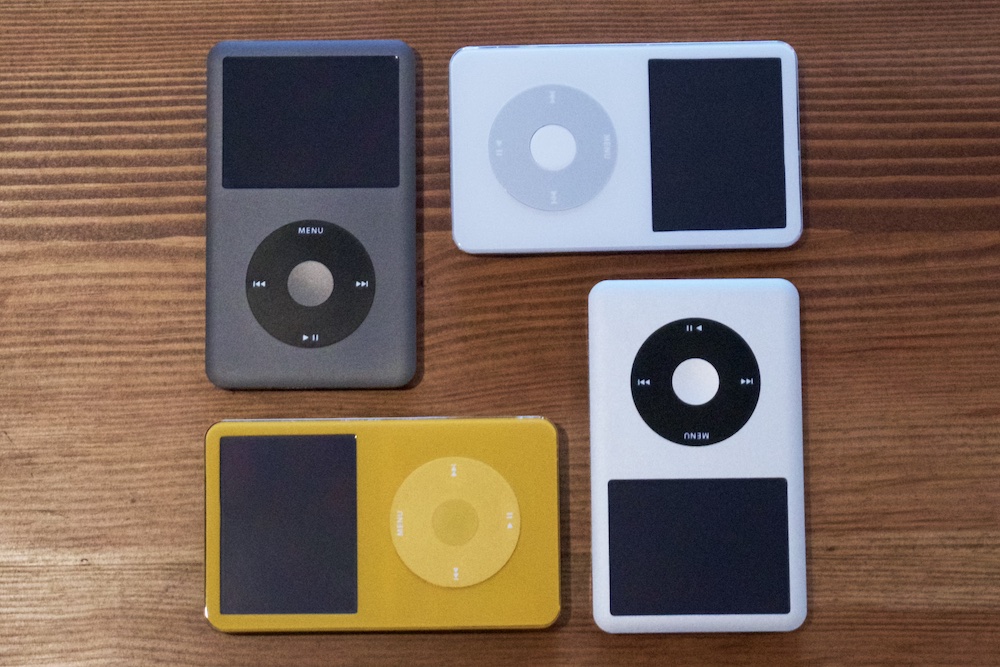 Four iPods Classic, arranged in a square.