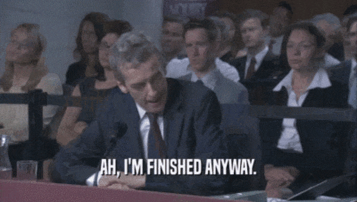 Malcolm Tucker sat at a desk in front of a Parliamentary inquiry. Caption reads: âAh, I'm finished anywayâ.
